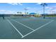 Well-maintained tennis courts with seating area at 12432 Golden Sage Dr, Sarasota, FL 34238