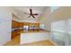 Bright kitchen with wood cabinets, granite counters, and island at 4028 Mira Lago Dr, Sarasota, FL 34238