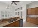 Kitchen with granite countertops, double sink, and ample wood cabinets at 4028 Mira Lago Dr, Sarasota, FL 34238