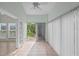 Sunroom featuring tile flooring and sliding glass doors leading to the outdoors at 4028 Mira Lago Dr, Sarasota, FL 34238