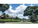 Residential homes along a pond with lush landscaping at 4028 Mira Lago Dr, Sarasota, FL 34238