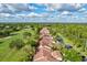 Aerial view of townhouses with brown roofs at 6241 Timberlake Dr # D7, Sarasota, FL 34243