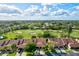 Aerial view of community, featuring homes, golf course, and pool at 6241 Timberlake Dr # D7, Sarasota, FL 34243