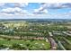 Aerial view of community with golf course and lake at 6241 Timberlake Dr # D7, Sarasota, FL 34243