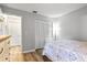 Bright bedroom with double doors and wood-look floors at 6241 Timberlake Dr # D7, Sarasota, FL 34243