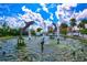 Circular fountain with dolphin sculptures and water jets, providing a scenic waterfront view at 6241 Timberlake Dr # D7, Sarasota, FL 34243