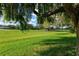 Lush green golf course with trees and homes at 6241 Timberlake Dr # D7, Sarasota, FL 34243