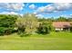 View of homes beside a green golf course at 6241 Timberlake Dr # D7, Sarasota, FL 34243