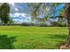 Lush green golf course with homes in the background at 6241 Timberlake Dr # D7, Sarasota, FL 34243