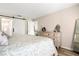 Main bedroom with dresser and barn door leading to the bathroom at 6241 Timberlake Dr # D7, Sarasota, FL 34243