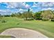 Sand trap on a green golf course at 6241 Timberlake Dr # D7, Sarasota, FL 34243