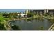 Aerial of resort community with pond and fountain at 1095 Gulf Of Mexico Dr # 502, Longboat Key, FL 34228