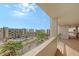 Balcony overlooking the resort grounds and partial ocean view at 1095 Gulf Of Mexico Dr # 502, Longboat Key, FL 34228