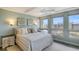 Bright bedroom with water views and king-size bed at 1095 Gulf Of Mexico Dr # 502, Longboat Key, FL 34228