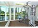 Modern gym with weight machines and a view at 1095 Gulf Of Mexico Dr # 502, Longboat Key, FL 34228