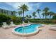 Relaxing hot tub with surrounding lounge chairs at 1095 Gulf Of Mexico Dr # 502, Longboat Key, FL 34228