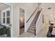 Stylish staircase leading to upper level, view of bedroom and living area at 11454 Rolling Green Dr, Bradenton, FL 34211