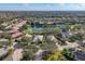 An aerial view of a beautiful community with lush landscaping and a serene lake at 12240 Thornhill Ct, Lakewood Ranch, FL 34202