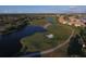 Picturesque aerial view of a golf course with scenic water hazards and residential areas at 12240 Thornhill Ct, Lakewood Ranch, FL 34202