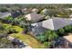 Aerial view of the back of the property showcasing the screened in pool and landscaping at 12240 Thornhill Ct, Lakewood Ranch, FL 34202