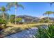 Backyard view showcasing the screened in pool and outdoor living space of the property at 12240 Thornhill Ct, Lakewood Ranch, FL 34202