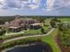 Expansive clubhouse with golf course views and meticulous landscaping, showcasing a luxury lifestyle at 12240 Thornhill Ct, Lakewood Ranch, FL 34202