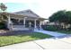 Charming clubhouse exterior with stone accents, a covered porch, and well-maintained landscaping at 12240 Thornhill Ct, Lakewood Ranch, FL 34202