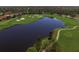 Expansive golf course featuring a large lake and sand traps, set among a lush green landscape at 12240 Thornhill Ct, Lakewood Ranch, FL 34202