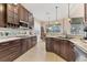 Stylish kitchen with dark wood cabinets, countertops, and stainless steel appliances at 12240 Thornhill Ct, Lakewood Ranch, FL 34202