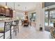 Cozy kitchen nook with a breakfast table, striped walls and pool access at 12240 Thornhill Ct, Lakewood Ranch, FL 34202