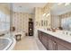 Elegant bathroom with a soaking tub, separate shower, and double vanity at 12240 Thornhill Ct, Lakewood Ranch, FL 34202