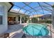 Beautiful in-ground pool with screened enclosure and outdoor living space at 12240 Thornhill Ct, Lakewood Ranch, FL 34202