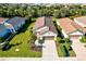 Aerial view of single-Gathering home with tile roof, landscaping, and driveway at 12640 Coastal Breeze Way, Bradenton, FL 34211