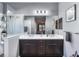 Double vanity bathroom with a walk-in shower and modern fixtures at 12640 Coastal Breeze Way, Bradenton, FL 34211