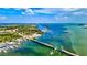 Aerial view of a drawbridge over a bay with boats and lush greenery at 12640 Coastal Breeze Way, Bradenton, FL 34211