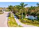 Indigo community entrance with palm trees and walkway at 12640 Coastal Breeze Way, Bradenton, FL 34211