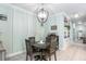 Charming dining area with round table and built-in shelving at 12640 Coastal Breeze Way, Bradenton, FL 34211