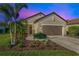 Attractive single-story home with landscaping and two-car garage at 12640 Coastal Breeze Way, Bradenton, FL 34211