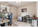 Bright home office features built-in shelving and a desk at 12640 Coastal Breeze Way, Bradenton, FL 34211