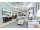 Open living room showcasing a spacious layout, comfortable seating, and seamless flow into the kitchen at 12640 Coastal Breeze Way, Bradenton, FL 34211