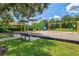 playground with swings, slides, and play structures at 12640 Coastal Breeze Way, Bradenton, FL 34211