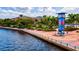 Scenic waterfront walkway with city views and art installation at 12640 Coastal Breeze Way, Bradenton, FL 34211