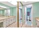 Main bathroom with double vanity and shower at 14459 River Beach Dr # 112, Port Charlotte, FL 33953