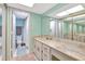 Main bathroom with double vanity and shower at 14459 River Beach Dr # 112, Port Charlotte, FL 33953