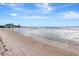 Expansive beachfront view showcasing calm waters and sandy shore at 14459 River Beach Dr # 112, Port Charlotte, FL 33953