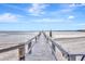 Wooden dock extending into the water, providing water access at 14459 River Beach Dr # 112, Port Charlotte, FL 33953