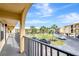 View from a balcony overlooking a tropical courtyard at 14459 River Beach Dr # 112, Port Charlotte, FL 33953