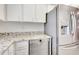 Modern kitchen with granite countertops and stainless steel appliances at 14459 River Beach Dr # 112, Port Charlotte, FL 33953