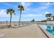 Relaxing pool area with lounge chairs and ocean views at 14459 River Beach Dr # 112, Port Charlotte, FL 33953