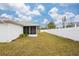 Spacious backyard with white vinyl fence at 1565 Piedmont Rd, Venice, FL 34293